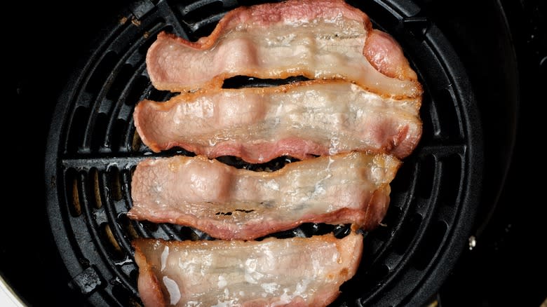 Fatty bacon in air fryer basket