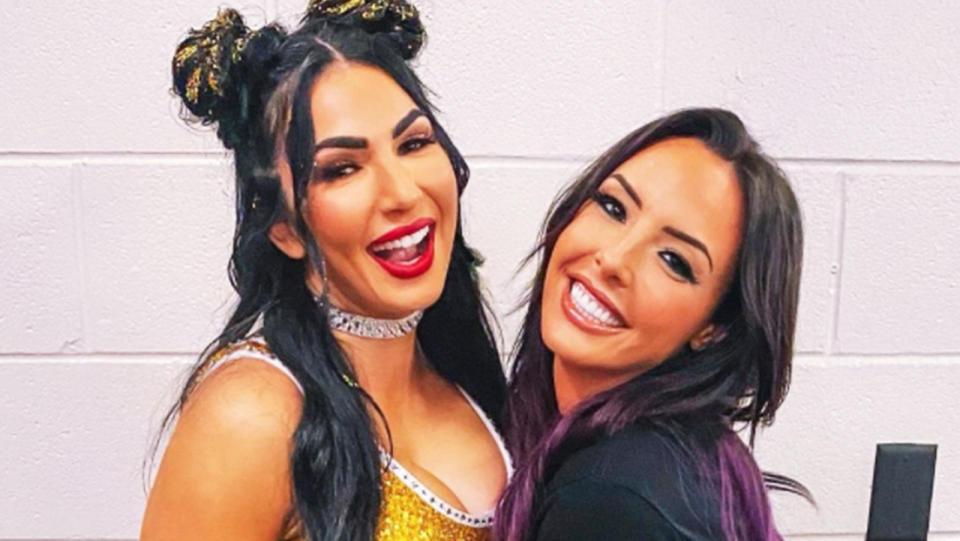 Aussies Billie Kay and Peyton Royce sharing a hug during the WWE.