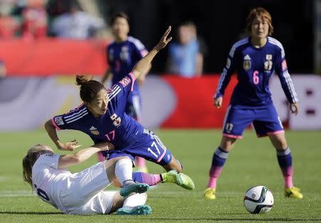 Jul 1, 2015; Edmonton, Alberta, CAN; England defender Laura Bassett (6) fouls Japan forward Mana Iwabuchi (16) during the second half in the semifinals of the FIFA 2015 Women's World Cup at Commonwealth Stadium. Mandatory Credit: Erich Schlegel-USA TODAY Sports