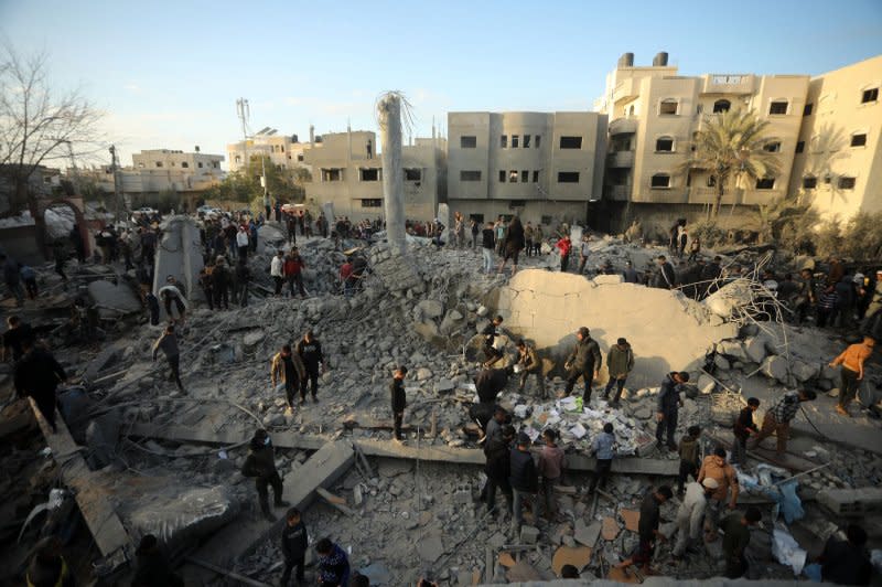 Palestinians sift through rubble while searching for victims and survivors at a mosque in Rafah following an Israeli air strike in the southern Gaza Strip on Wednesday. The IDF says it targeted terrorist activities in the region. Photo by Ismael Mohamad/UPI