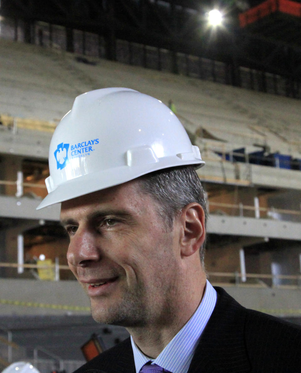 Mikhail Prokhorov, Russian billionaire and owner of the New Jersey Nets basketball team, speaks during a news conference at the Barclays Center arena on Tuesday, April 10, 2012 in the Brooklyn borough of New York. Prokhorov surveyed the ongoing construction for the Nets new home and said he's "very committed" to bringing an NBA title to Brooklyn. (AP Photo/Bebeto Matthews)