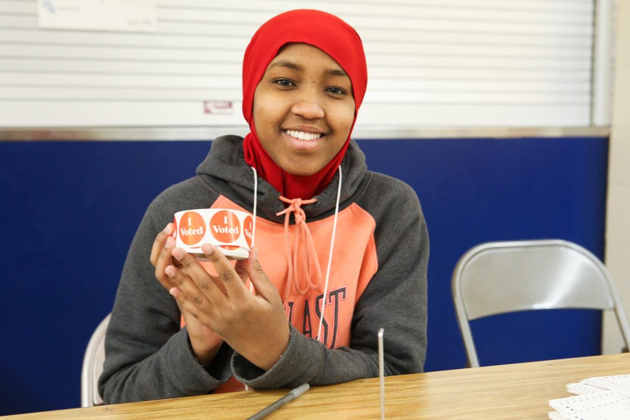 A Minneapolis student works at a polling place Jan. 21