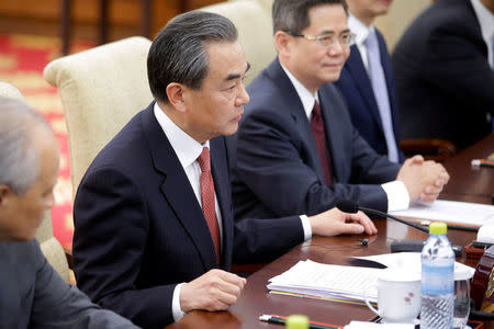 Chinese Foreign Minister Wang Yi speaks during a bilateral meeting with U.S. Secretary of State Rex Tillerson (not shown) at the Diaoyutai State Guesthouse in Beijing, China, Saturday, March 18, 2017. REUTERS/Mark Schiefelbein/Pool