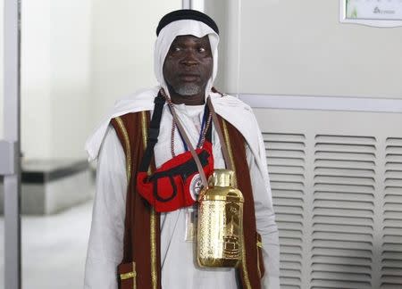 A pilgrim returning from his Haj in Saudi Arabia looks on at the General Aviation Terminal of the Abuja Airport, Nigeria September 29, 2015. REUTERS/Afolabi Sotunde