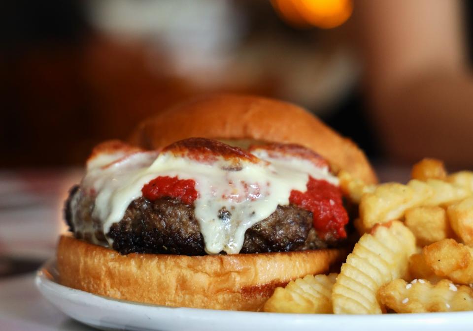 The Pizza Burger at Tavern Pi in Jupiter boasts a hefty, smashed meatball, melted mozzarella, pepperoni and pizza sauce.