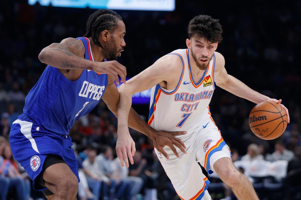 Oklahoma City Thunder forward Chet Holmgren (7) tries to get past LA Clippers guard James Harden (1) during an NBA basketball game between the Oklahoma City Thunder and the Los Angeles Clippers at Paycom Center in Oklahoma City, Thursday, Feb. 22, 2024. The Thunder won 129-107.