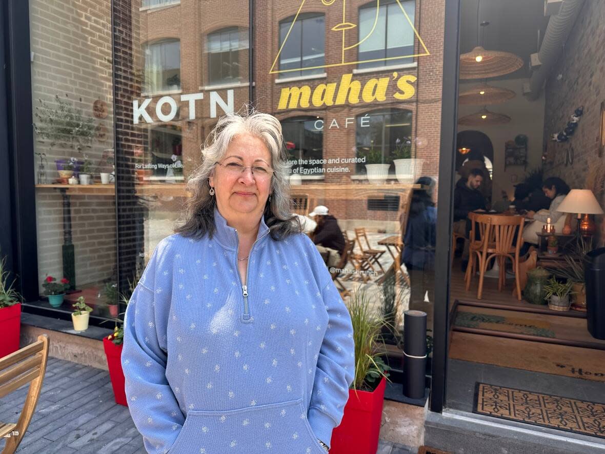 Maha Barsoom owns the restaurant Maha's Brunch, and opened Maha's Cafe on Queen Street East with her children a little more than a week ago. On Tuesday, the new location was broken into. (Talia Ricci/CBC - image credit)