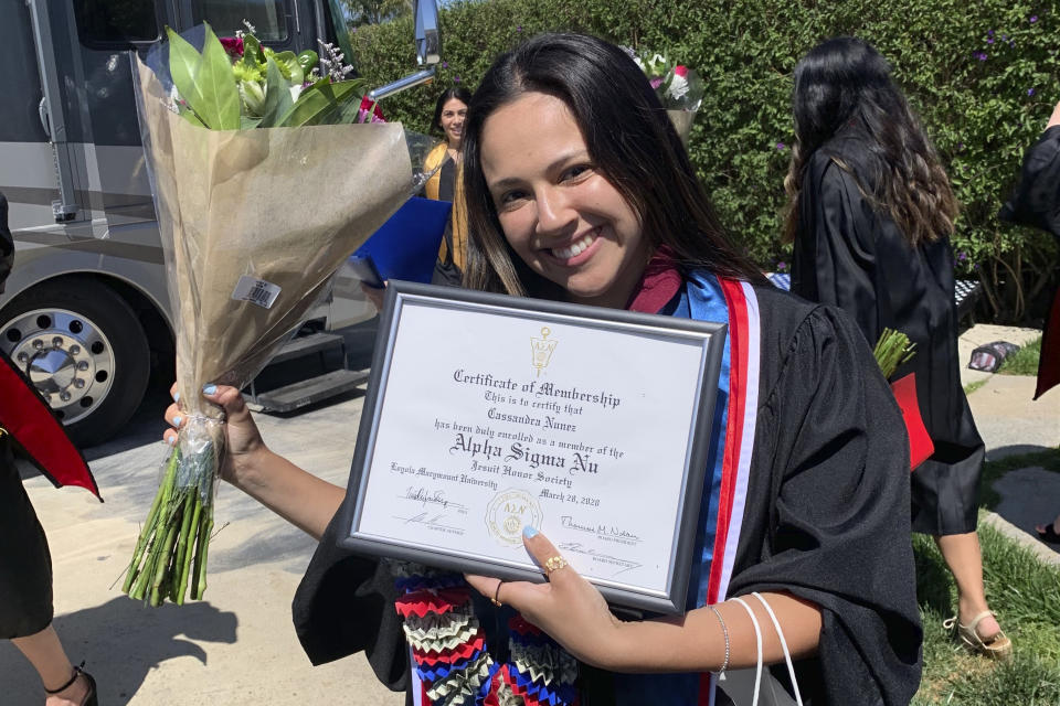 In this photo provided by Andrea Nuñez, her sister, Cassandra Nuñez, celebrates in a virtual college graduation near her home in Watsonville, Calif., on May 9, 2020. Nuñez hoped to help elect the first woman president when she voted at Loyola Marymount University in November 2016, but instead felt Donald Trump's victory was a "double whammy" given Hillary Clinton's loss and Trump's behavior toward women. (Andrea Nuñez via AP)