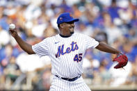 Former New York Mets pitcher Pedro Martinez throws during an Old-Timers' game before a baseball game between the Colorado Rockies and the New York Mets on Saturday, Aug. 27, 2022, in New York. (AP Photo/Adam Hunger)
