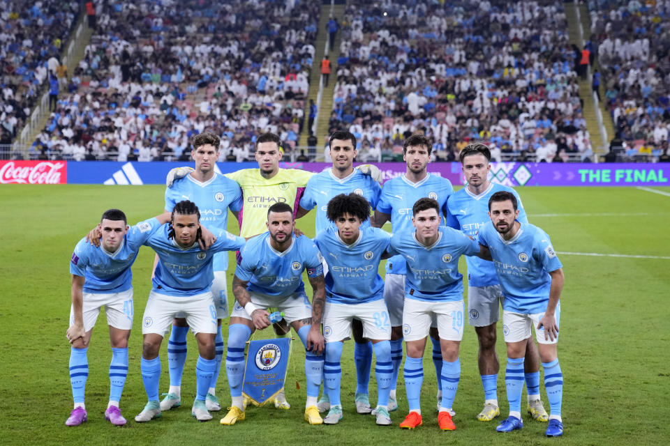 Manchester City players pose before the Soccer Club World Cup final match between Manchester City FC and Fluminense FC at King Abdullah Sports City Stadium in Jeddah, Saudi Arabia, Friday, Dec. 22, 2023. (AP Photo/Manu Fernandez)