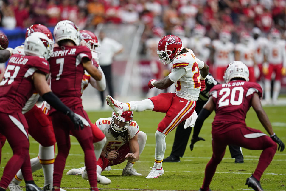 Kansas City Chiefs safety Justin Reid (20) kicks an extra point against the Arizona Cardinals during the first half of an NFL football game, Sunday, Sept. 11, 2022, in Glendale, Ariz. (AP Photo/Ross D. Franklin)