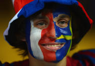 KIEV, UKRAINE - JUNE 19: A football fan wearing the colours of France and Sweden smiles prior to the UEFA EURO 2012 group D match between Sweden and France at The Olympic Stadium on June 19, 2012 in Kiev, Ukraine. (Photo by Lars Baron/Getty Images)