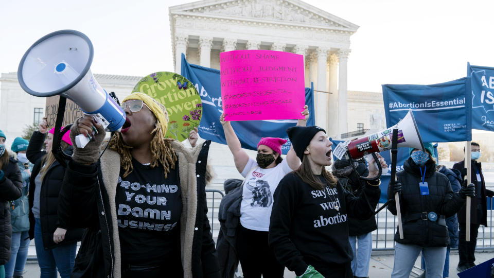 Abortion rights advocates demonstrate in front of the U.S. Supreme Court Wednesday, Dec. 1, 2021, in Washington, as the court hears arguments in a case from Mississippi, where a 2018 law would ban abortions after 15 weeks of pregnancy, well before viability. (AP Photo/Jose Luis Magana)