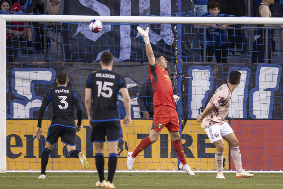 Portland Timbers goalkeeper David Bingham, second from right, deflects a free kick by San Jose Earthquakes midfielder Carlos Gruezo (not shown) during the first half of an MLS soccer match in San Jose, Calif., Saturday, June 17, 2023. (AP Photo/John Hefti)