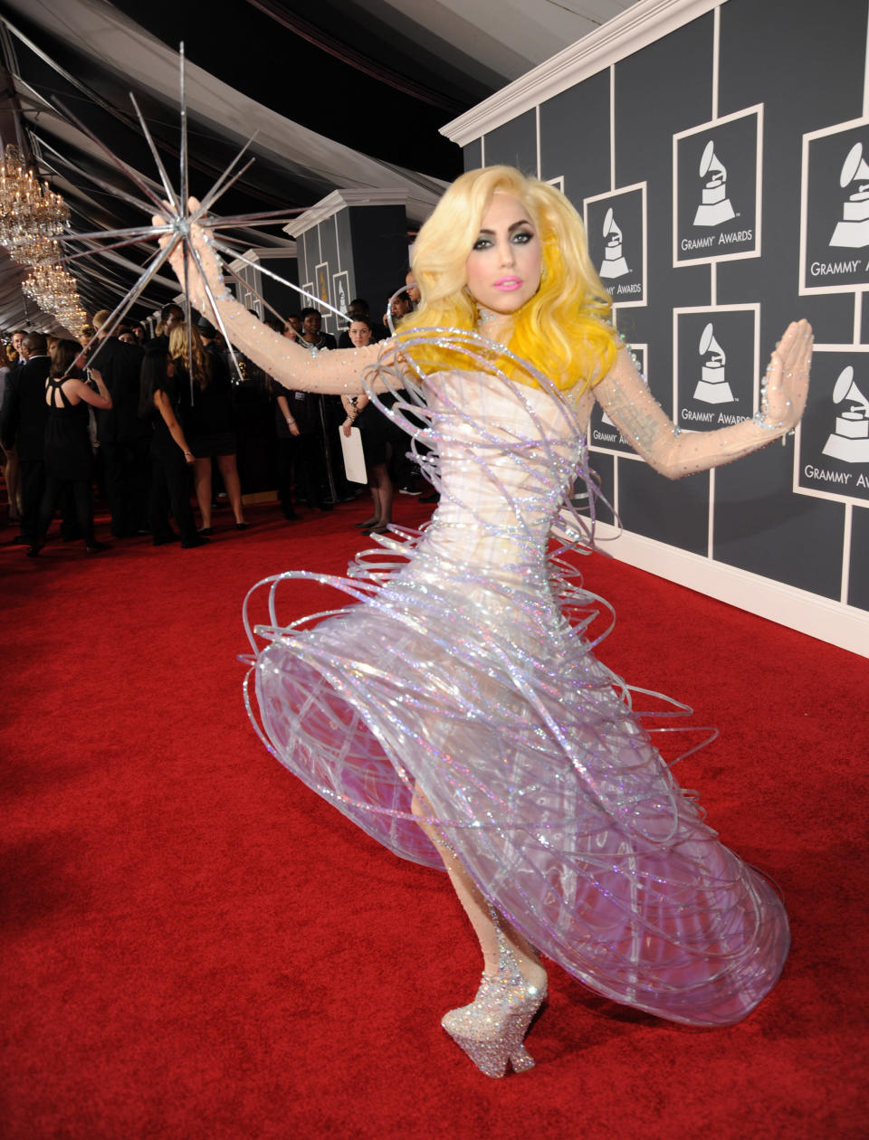 Lady Gaga at the 2010 GRAMMYs is what this whole business is all about: the glittering, fantastically bizarre Armani confection, constructed to look as if it was actually orbiting the singer’s body, and accessorized with a giant, spiky metal star, extraterrestrial-looking studded footwear, and a cartoonishly perfect face of Barbie makeup framed by a full head of ombre platinum and yellow hair. (Photo by Kevin Mazur/WireImage)
