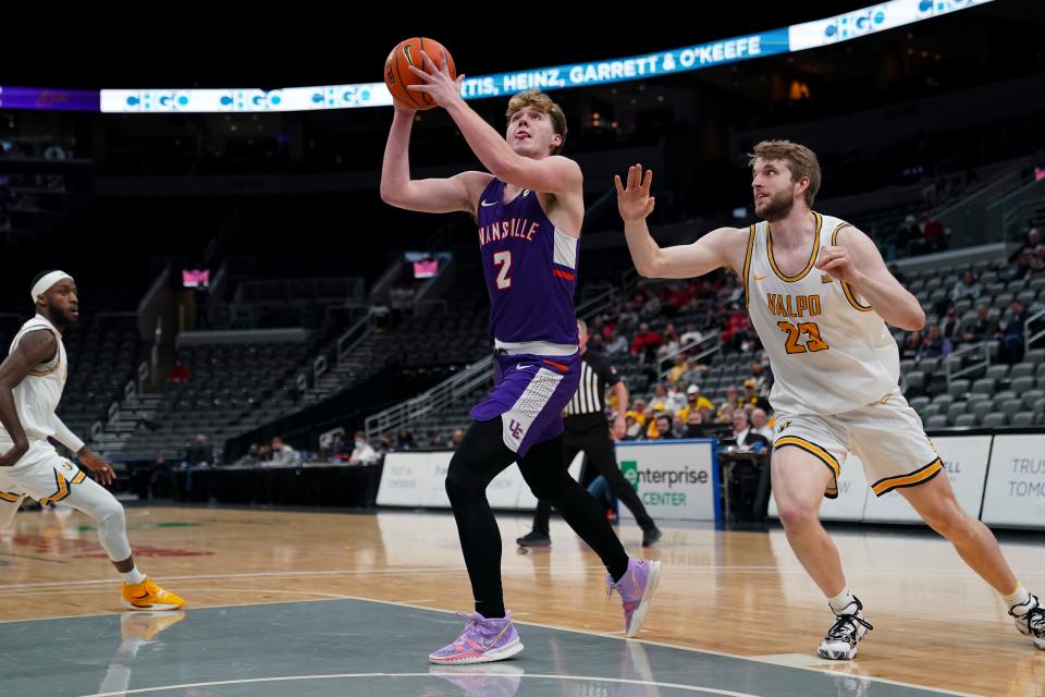 Evansville’s Blake Sisley (2) goes up for a shot as the University of Evansville Purple Aces play the Valparaiso University Beacons during the Missouri Valley Conference Tournament at the Enterprise Center in St. Louis, MO., Thursday, March 3, 2022. The No. 10 Evansville Purple Aces fell to the No. 7 Valparaiso Beacons,  81-59.