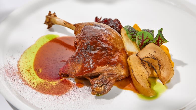 Duck confit on dinner plate
