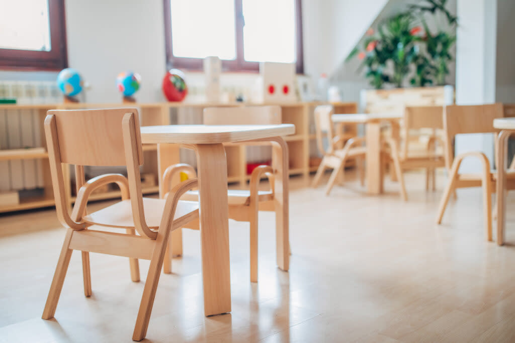 empty desks in an early elementary classroom