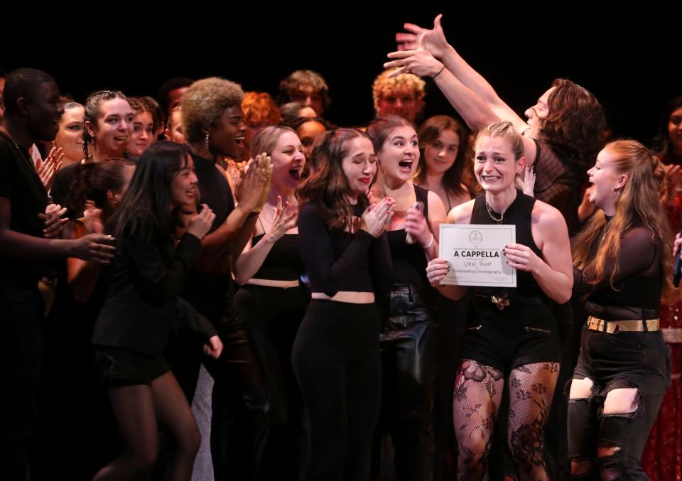 Members of University of Delaware's Vocal Point receive the award for "Outstanding Choreography" during the International Championship of Collegiate A Cappella Mid-Atlantic semifinal competition at the Playhouse on Rodney Square, Saturday, March 25, 2023.