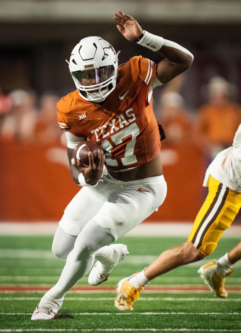 Texas running back Savion Red carries against Wyoming during the first quarter. He had two fourth-down conversions in the game out of the Wildcat formation and the Longhorns woke up from their three-quarter slumber to put the Cowboys away in the fourth, 31-10.