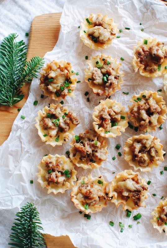 <p>Bev Cooks</p><p>These mini phyllo cups filled with sausage and gouda are the perfect bite-sized appetizers!</p><p><strong>Get the recipe: <a href="https://bevcooks.com/2017/12/sausage-gouda-phyllo-cups/" rel="nofollow noopener" target="_blank" data-ylk="slk:Sausage and Gouda Phyllo Cups;elm:context_link;itc:0;sec:content-canvas" class="link "><em>Sausage and Gouda Phyllo Cups</em></a></strong></p>