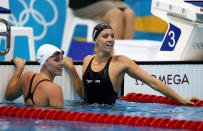 LONDON, ENGLAND - JULY 29: Dana Vollmer (R) of the United States celebrates after winning the gold medal and setting a new world record time of 55.98 seconds in the Women's 100m Butterfly final on Day 2 of the London 2012 Olympic Games at the Aquatics Centre on July 29, 2012 in London, England. (Photo by Clive Rose/Getty Images)