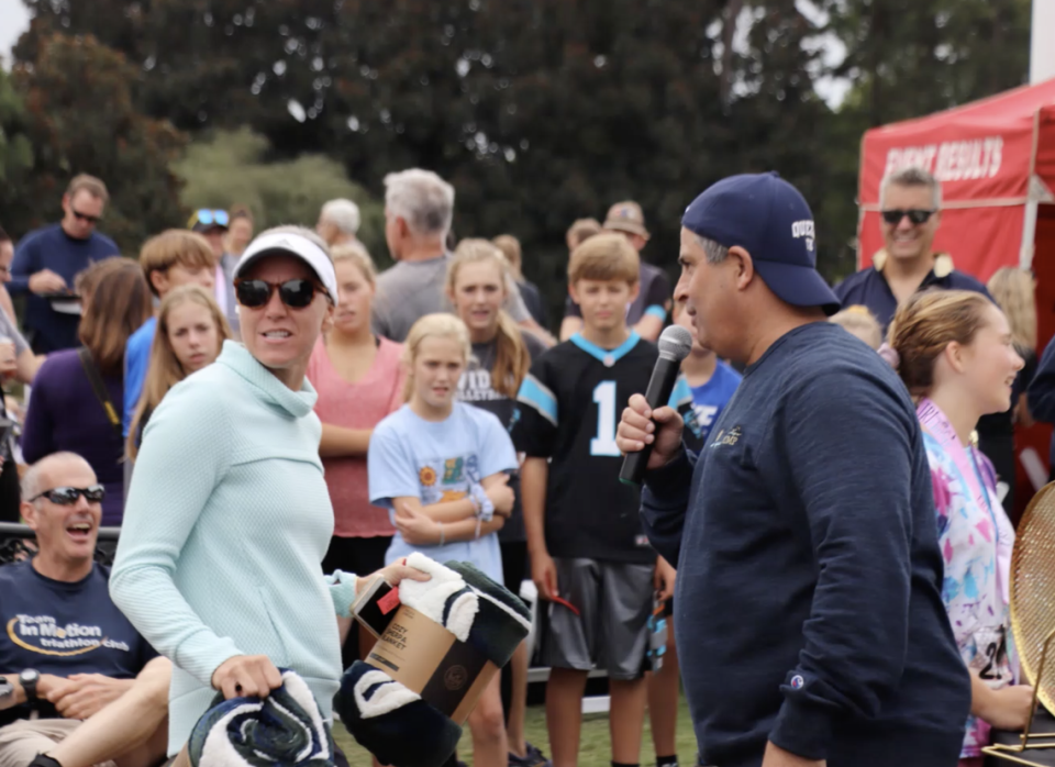 Chuck McAllister emceeing the post-race festivities at Tri at the Trump in 2019.