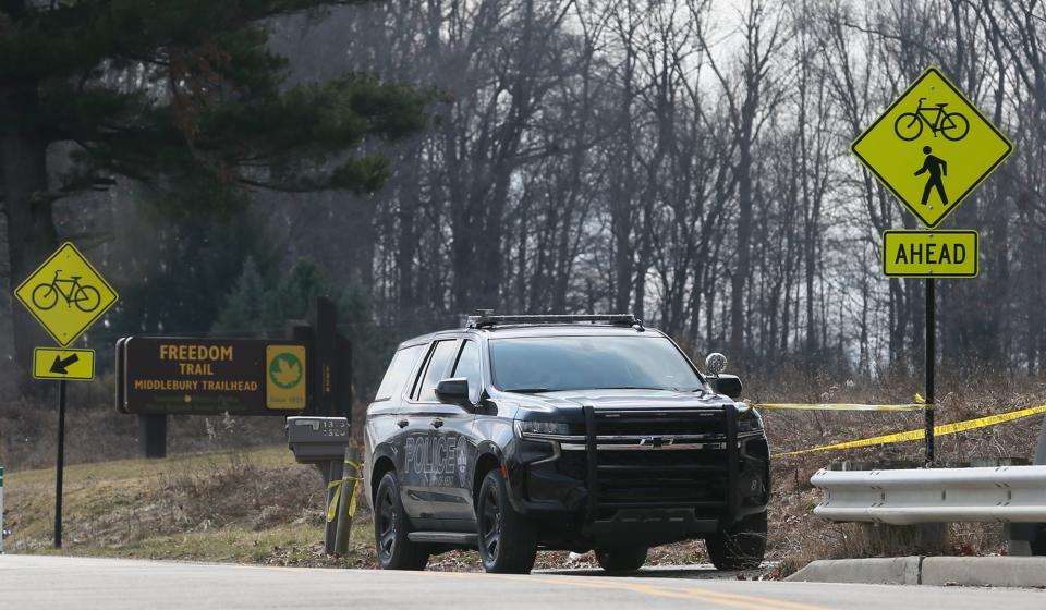 A Kent Police vehicle and police tape block the entrance to the park lot for the Freedom Trail Middlebury Trailhead in Kent Tuesday.