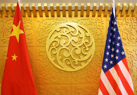 FILE PHOTO: Chinese and U.S. flags are set up for a meeting during a visit by U.S. Secretary of Transportation Elaine Chao at China's Ministry of Transport in Beijing, China April 27, 2018. REUTERS/Jason Lee/File Photo