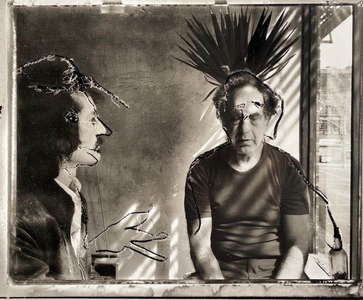 A self-portrait Brian Graham, left, took with Robert Frank that’s included in his new book. Frank wasn’t happy with it, so he later scratched the negative. (Brian Graham - image credit)