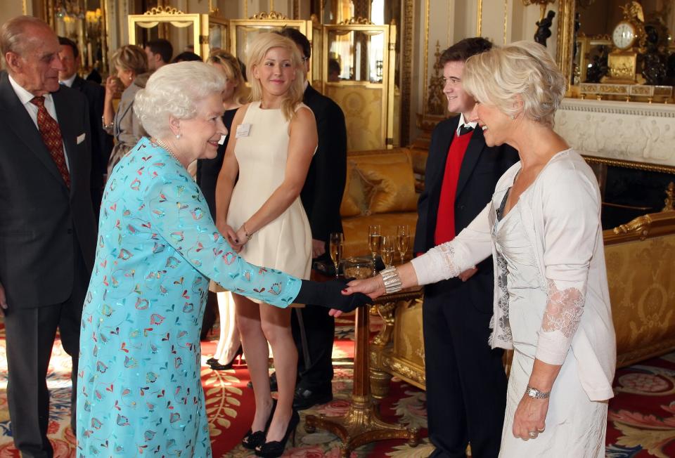 Queen Elizabeth II meets with Dame Helen Mirren (R) at a performing Arts reception at Buckingham Palace on May 9, 2011 in London, England.