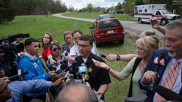 Lt. Michael Preston, of the Ross County Sheriff's Department speaks to the media on Union Hill Road that approaches a crime scene. Photo: AP