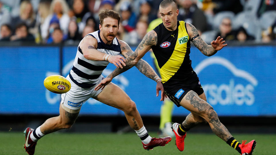 Dustin Martin is pictured playing for Richmond against Geelong's Zac Tuohy.