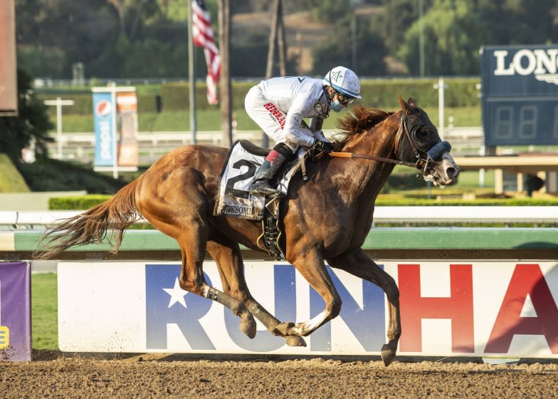 Improbable, with Drayden Van Dyke aboard, races in the Grade 1 Awesome Again Stakes at Santa Anita on Sept. 26, 2020.