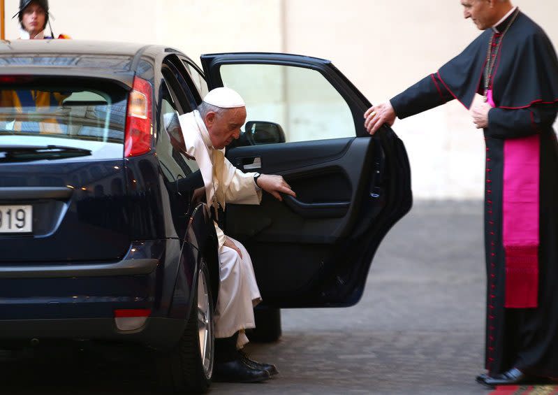 Archbishop Georg Ganswein greets Pope Francis - Credit: Reuters