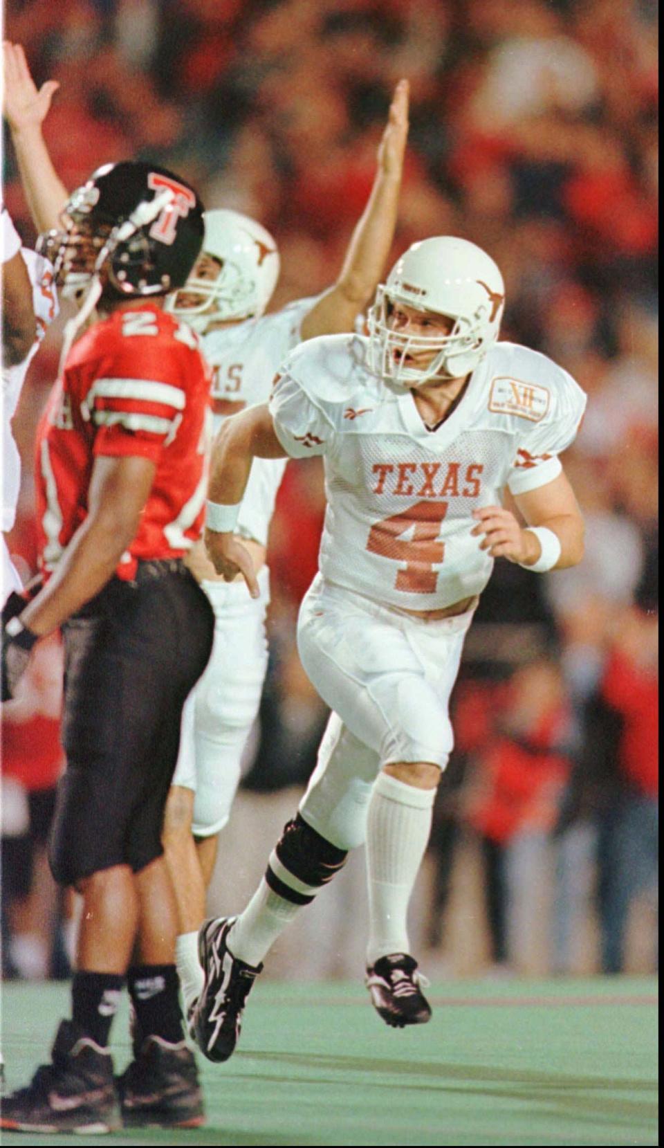 Texas kicker Phil Dawson watches his 53-yard field goal go through the uprights to seal a 38-32 win over Texas Tech in 1996. The former Lake Highlands standout finished his Longhorns career with 13 school kicking records.