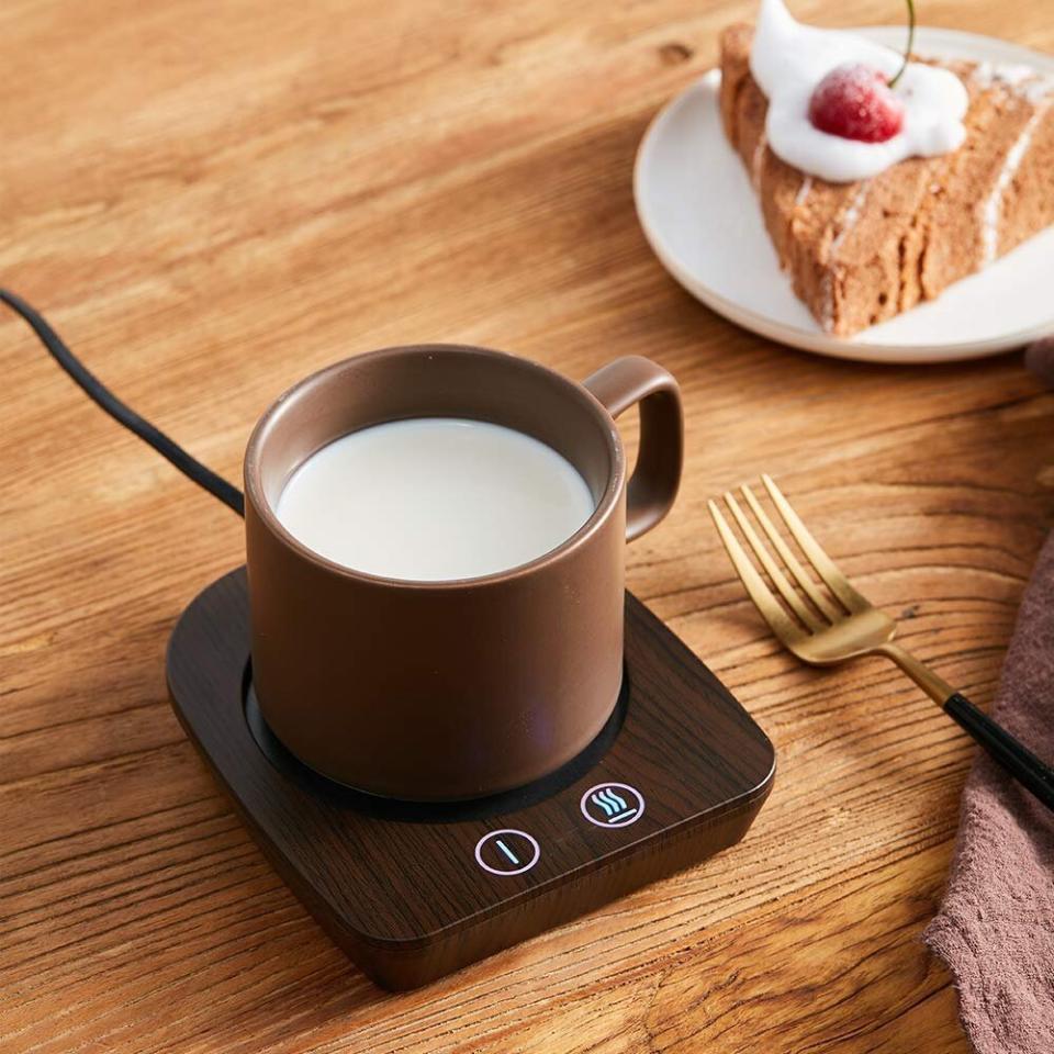 In the middle of the day, it's caffeine o'clock. This coffee heater will keep your favorite mug warm enough as you answer all those emails. <a href="https://amzn.to/3aQDIcM" target="_blank" rel="noopener noreferrer">Find it for $22 to $28, depending on the color, at Amazon</a>.