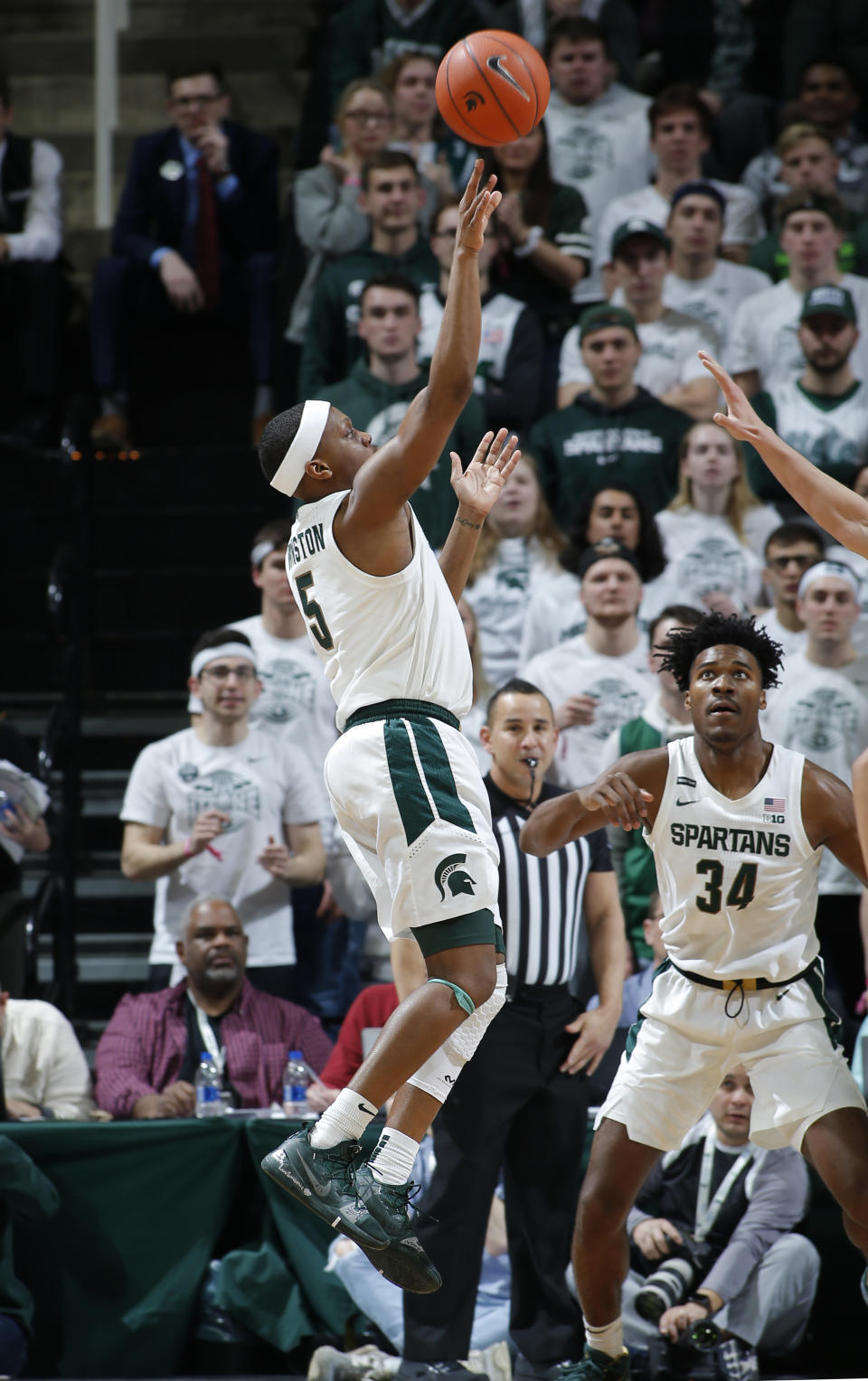 Michigan State's Cassius Winston shoots against Iowa during the first half of an NCAA college basketball game, Tuesday, Feb. 25, 2020, in East Lansing, Mich. (AP Photo/Al Goldis)