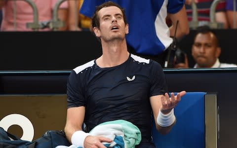 Britain's Andy Murray reacts after losing a game to Spain's Roberto Bautista Agut during their first round men's singles match on day one of the Australian Open tennis tournament in Melbourne on January 14, 2019 - Credit: AFP