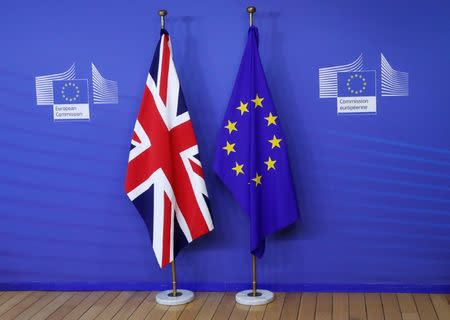 FILE PHOTO - Flags are seen at the EU Commission headquarters ahead of a first full round of talks on Brexit, Britain's divorce terms from the European Union, in Brussels, Belgium July 17, 2017. REUTERS/Yves Herman