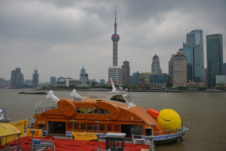 A boat made to look like a roasted duck on the Huangpu River in Shanghai on August 27, 2013. It is the city's roasted version of Hong Kong's giant rubber duck, which attracted tens of thousands of admirers when it was moored in Victoria Harbour