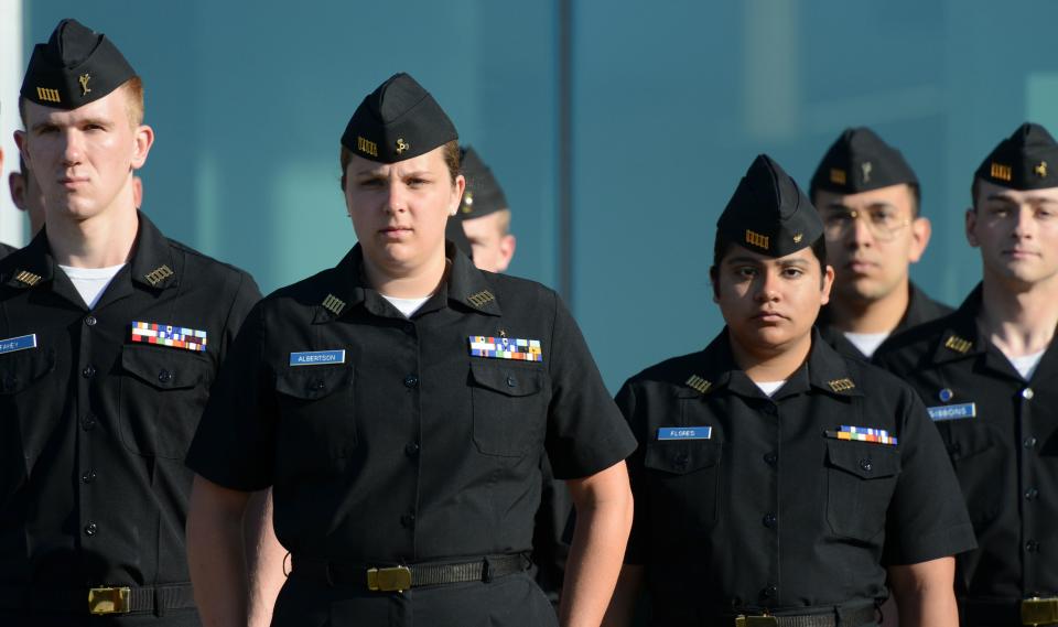 Paige Albertson, from Nantucket, center, leads the morning formation ceremony at Massachusetts Maritime Academy on June 7. Steve Heaslip/Cape Cod Times