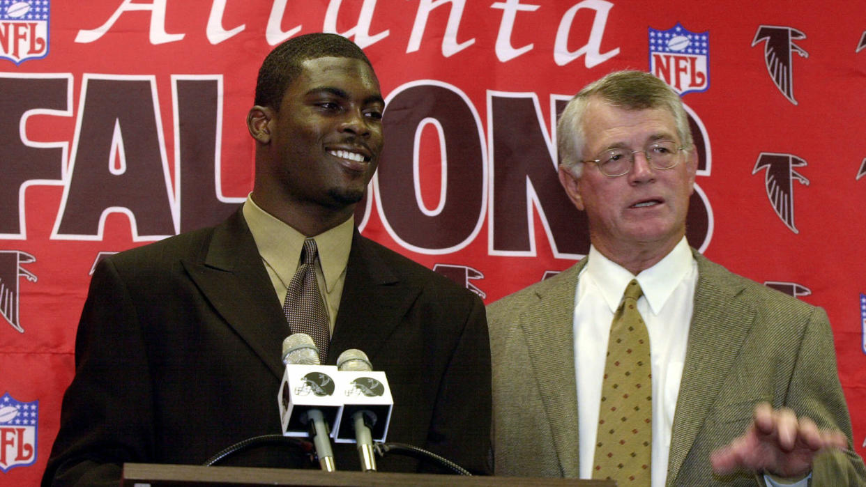 Mandatory Credit: Photo by Ric Feld/AP/Shutterstock (6468566a)VICK FALCONS REEVES Atlanta Falcons first round pick Michael Vick, left, and head coach Dan Reeves talk to members of the media at a press conference at the Falcons Flowery Branch, Ga.
