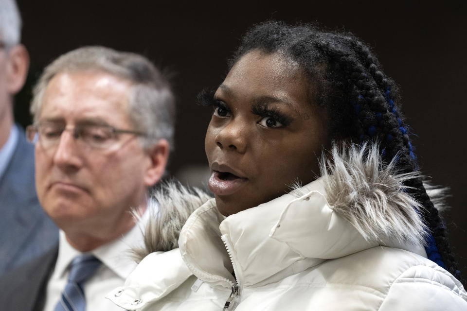 Janiah Caine, 18, who was previously in the care of Illinois Department of Children and Family Services as a minor, speaks about her experience during a press conference announcing a class action lawsuit alleging the DCFS has wrongfully incarcerated minors in its care. Thursday, Jan. 19, 2023, at the offices of Loevy & Loevy Attorneys at Law in Chicago. Caine spoke about the consequences of being locked up for so long, and about losing her grandmother while she was incarcerated. (AP Photo/Erin Hooley)