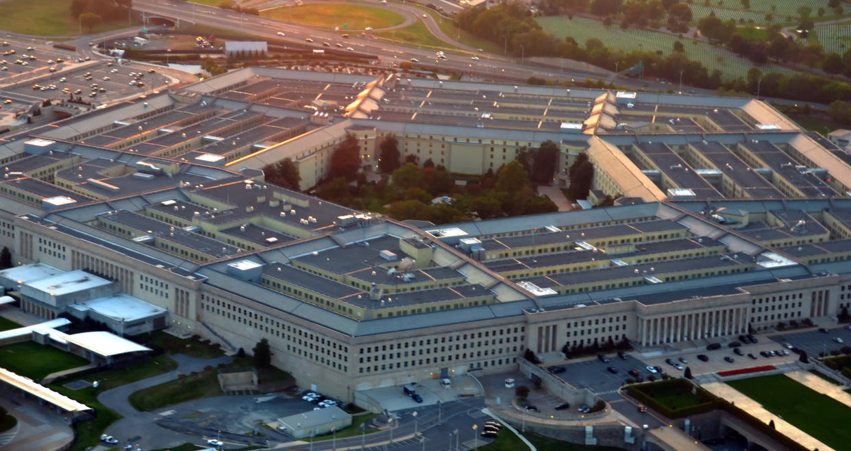 An aerial view of the Pentagon building at sunset.