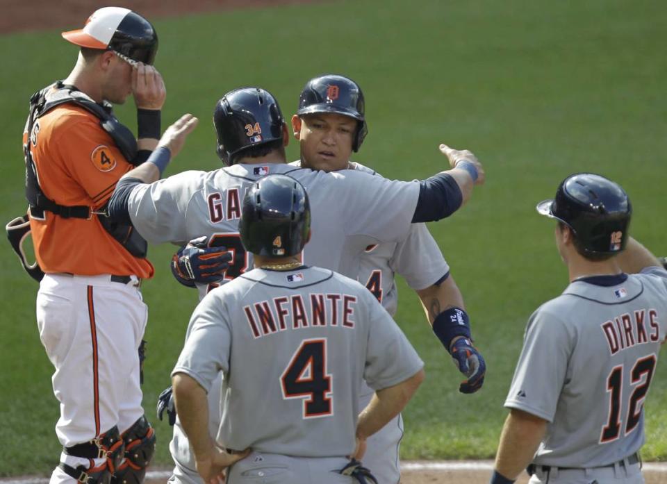 Detroit Tigers’ Miguel Cabrera, center, celebrates with teammate Avisail Garcia, Omar Infante (4) and Andy Dirks (12) after hitting a grand slam home run during the fourth inning of a baseball game against the Baltimore Orioles, Saturday, June 1, 2013, in Baltimore. (AP Photo/Luis M. Alvarez)