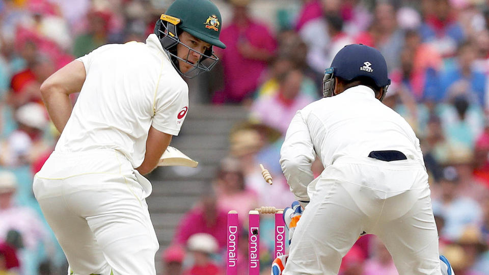 Tim Paine reacts as he is bowled by India’s Kuldeep Yadav. (Photo by DAVID GRAY/AFP/Getty Images)