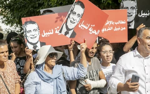 Supporters rally in front of the tribunal in the Tunisian capital - Credit: &nbsp;Anadolu