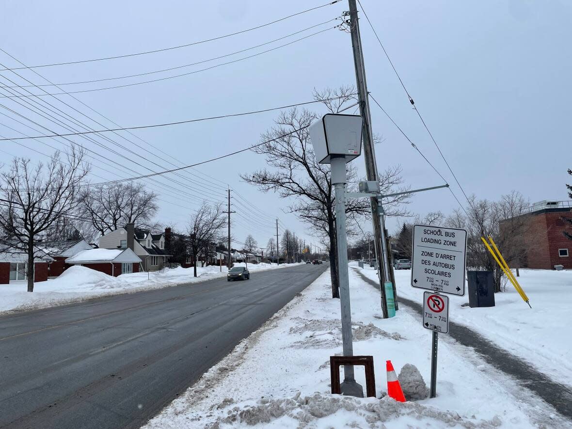 A speed camera points toward oncoming traffic on Smyth Road in Ottawa, one of existing current locations. The city plans to add 23 more. See below to find out where. (Nick Persaud/CBC - image credit)