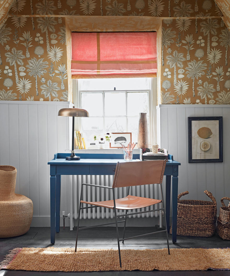 desk in home office space with white tongue and groove and mustard yellow wallpaper